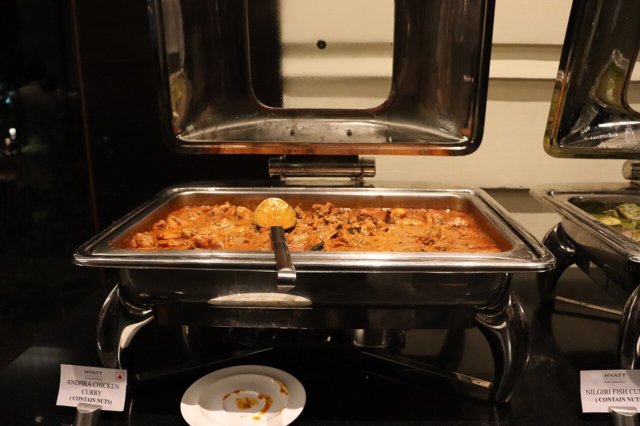 Andhra-style chicken curry with chicken pieces in a spicy reddish-brown gravy