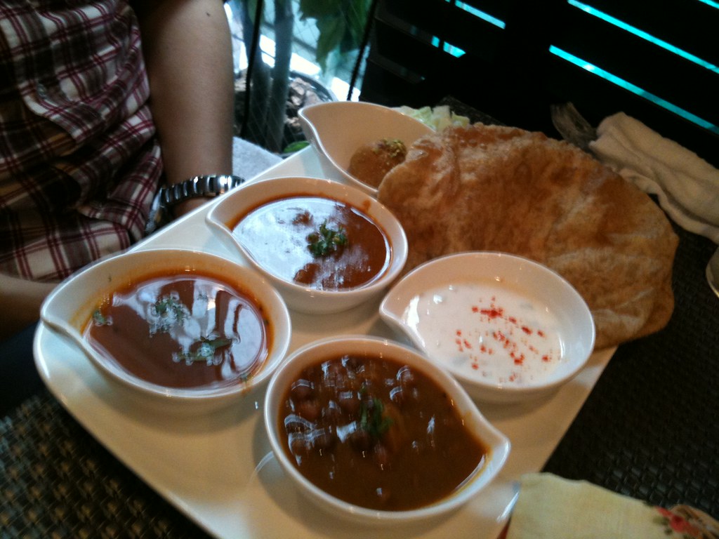 A colourful South Indian thali served with rice, curries and sides